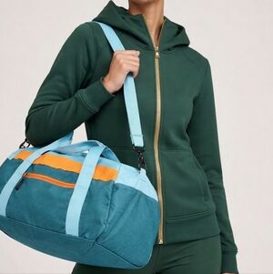 Sporty Blue and Orange Duffel Bag with Adjustable Strap